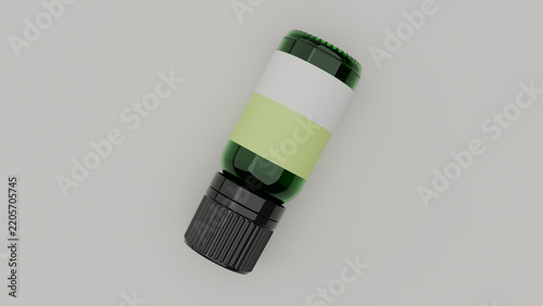 Green glass essential oil bottle flat lay top view