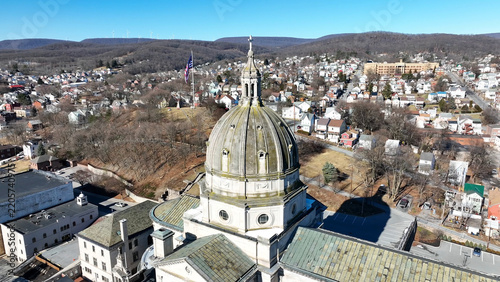 Aerial view of the Cathedral of the Blessed Sacrament with its prominent dome surrounded by residential neighborhoods and urban landscape in Altoona, Pennsylvania, United States.