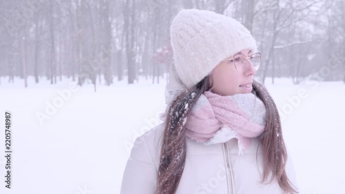 Woman outdoor calm. Female looking aside during snowy day. Peaceful solitude concept.