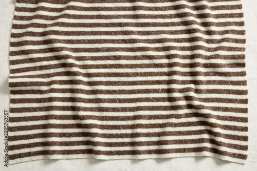 Close-up of a brown and white striped fabric texture.
