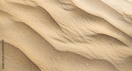 Warm golden sand dune smooth ripple pattern natural texture minimal abstract desert soft flowing form. Elegant nature closeup design scene. Neutral contemporary surface artistic wall decor panorama
