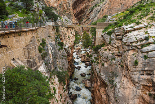 Steel footbridge over rushing rapids in the Gaitanejo gorge at Caminito del Rey