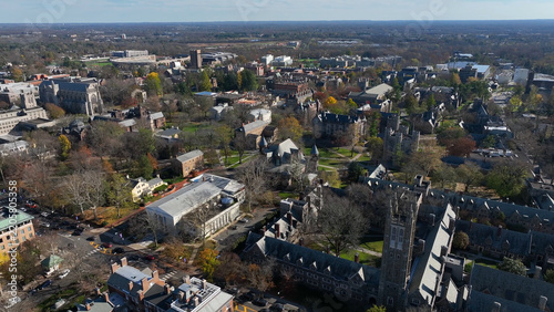 Aerial view of the Princeton University campus featuring historic gothic architecture, stone buildings, lush trees, and winding pathways in Princeton, New Jersey, United States.