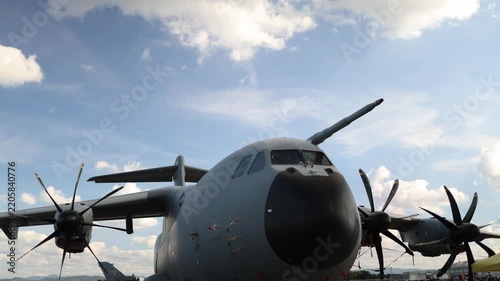 Airbus A400M military transport aircraft parked on an airfield with four turboprop engines showing massive cargo plane design and modern strategic airlift capability worldwide