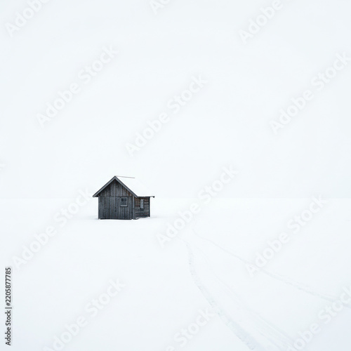 house in snow on white back griund