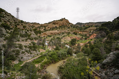 Guadalhorce river valley with cascades and sandstone hills near Caminito del Rey, Spain
