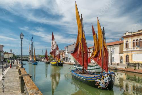 Historic sailing boats in the port canal of Cesenatico, Italy