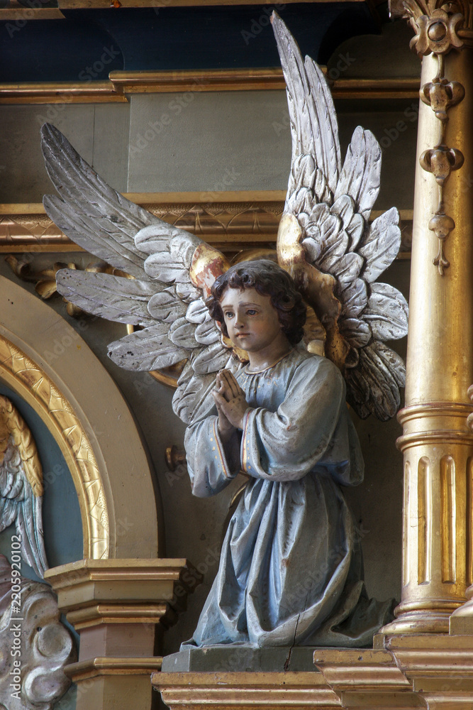 Obraz premium Angel, statue on the main altar in the parish church of the Sacred Heart of Jesus in Velika Pisanica, Croatia