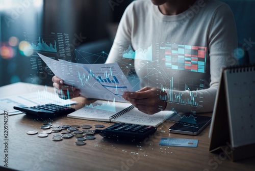 Business financial data analysis concept with digital charts, accounting documents, coins, and strategic budget planning