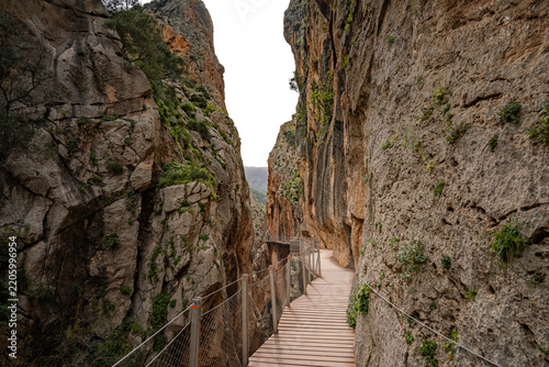 ooden boardwalk clinging to sheer canyon walls at Caminito del Rey, Spain