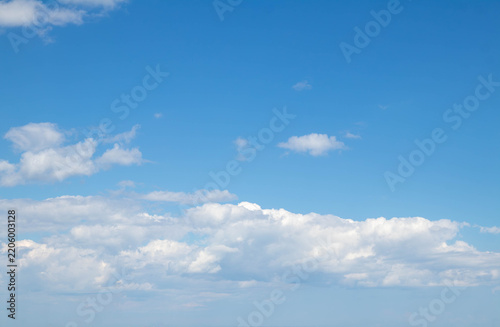 Sky replacement expansive light blue sky and puffy white clouds