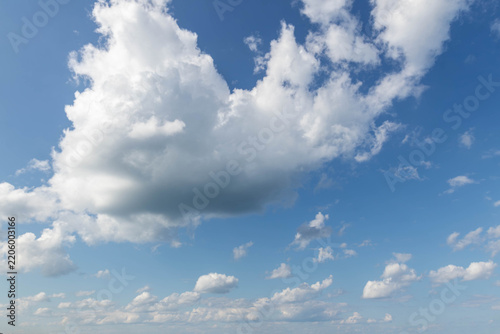 Sky replacement blue sky and puffy white clouds floating overhead