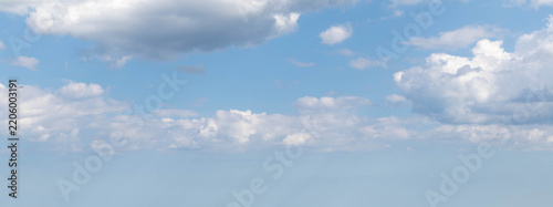 Sky replacement light blue sky and puffy white clouds
