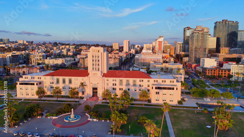 San Diego, United States - 01 April 2026: Aerial view of San Diego Probation Administration Center with its architecture, surrounded by parkland, palm trees, and the city skyline.