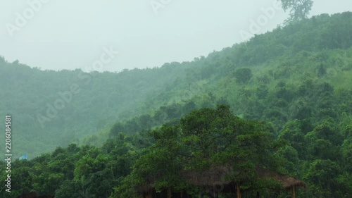 Rain Clouds Moving Over Misty Green Mountains in Countryside