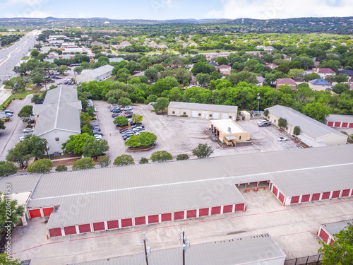 High angle perspective of a self storage property featuring multiple rows of rental units storage facility warehouse units parking lot mini storage real estate small business industrial ar