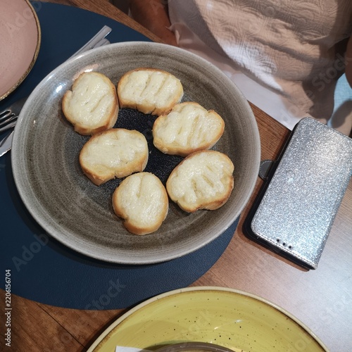 Toasted bread appetizers with cheese on a plate