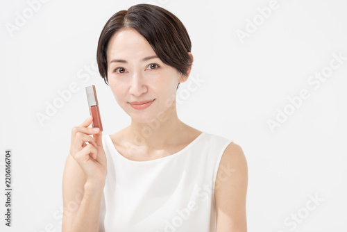 Fotografía 化粧品を持つ女性