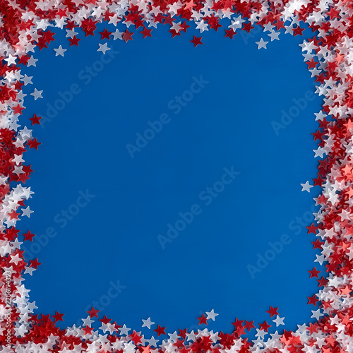 Red and white star confetti border on a blue background 