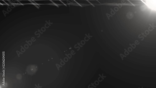 Anamorphic lens flare burst in slow motion, isolated on black background.
