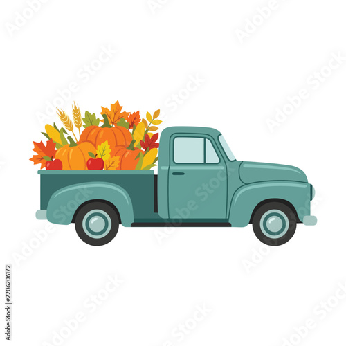 Vintage green pickup truck carrying autumn pumpkins and colorful fall leaves