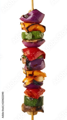 A delicious vegetable skewer featuring grilled zucchini, red onion, bell peppers, and mushrooms, threaded onto a wooden stick
