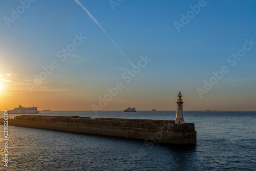 Lighthouse and harbor entrance of Dover, England