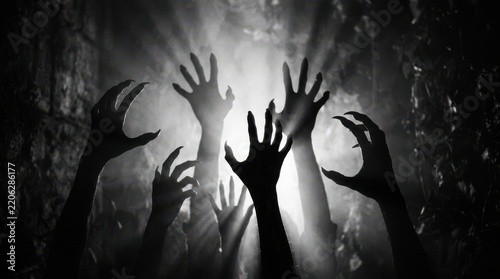 Scary monster hands reaching out in the dark
