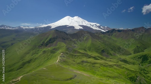 A beautiful view of the snow-capped peaks of Mount Elbrus (elevation 5,642 m). The landscape and nature of the North Caucasus.