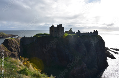 Romantic Silhouette of Clifftop Castle Against Ocean Spray