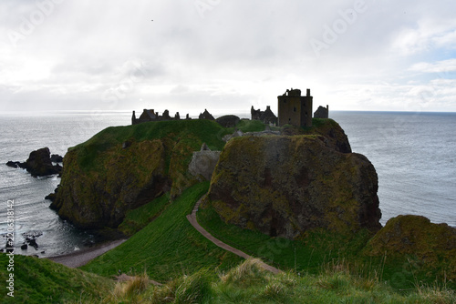 Legendary Scottish Castle Silhouetted Against Turbulent Sea