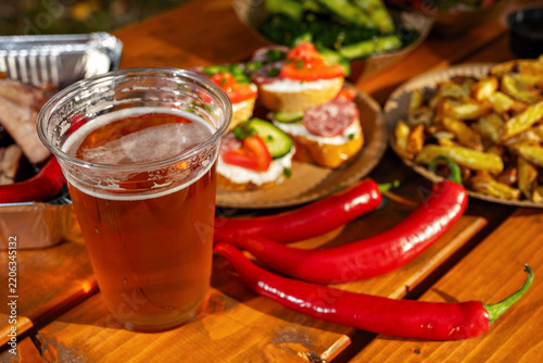 Gathering joy with refreshing beer and delicious snacks in a vibrant outdoor setting