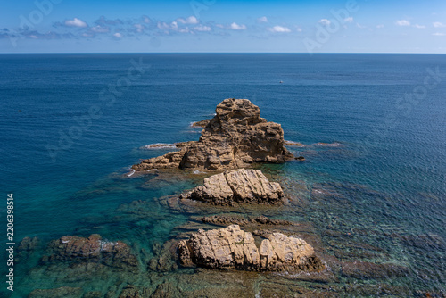 Javea coastline featuring rocky islets emerging from turquoise sea
