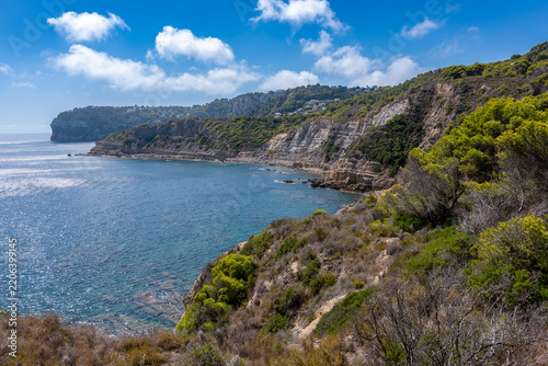 Javea coastline cliffs overlooking mediterranean sea in summer