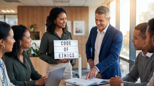 business man holding code of ethics light box with team golden hour office photography for corporate compliance and integrity