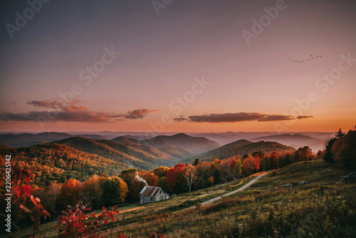 Atmospheric mountain landscape during colorful autumn sunset with mountains