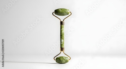 Natural Green Jade Stone Facial Roller for Beauty Treatment and Lymphatic Drainage on White Background