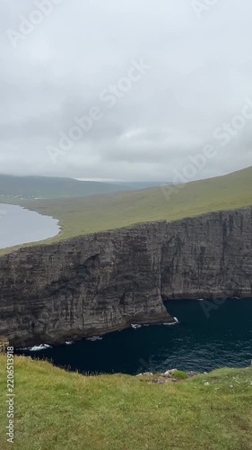 Sørvágsvatn (also called Leitisvatn), Lake above the Ocean located on Vágar Island, Faore Islands on Moody Day in Summer. Vertical Footage