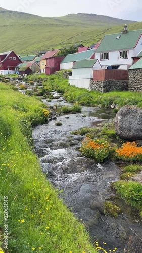 Gjógv, village located on the northeast tip of the island of Eysturoy, in the Faroe Islands in Summer. Vertical Footage