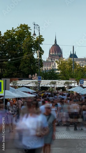 Budapest skyline timelapse with Hungarian Parliament dome viewed from Saint Stephen Day festival crowds on Miklos Square