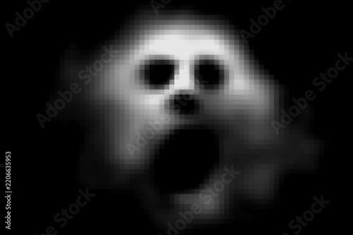 Blurred scary human face in the dark
