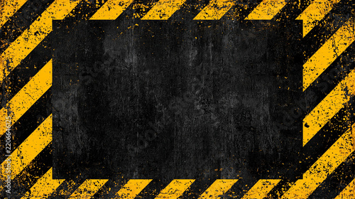Black grunge texture with hazard warning stripes border. Concept for danger, construction, or industrial area.