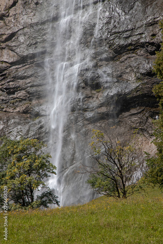 Staubbach waterfall water cascading down lauterbrunnen valley cliff