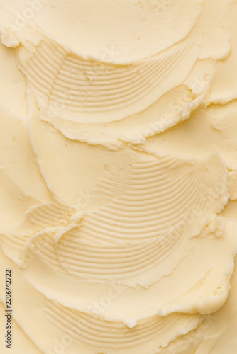 Creamy butter spread texture with ridged spatula strokes