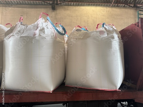 Chemical fertilizer Urea Stockpile white jumbo-bag Large ammonia nitrate in waiting for shipment is placed in the warehouse. Transport for farmers