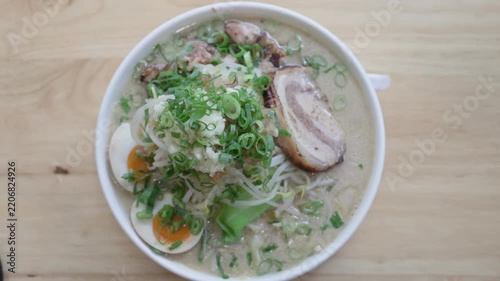 Overhead view of Jiro style ramen with pork egg and sprouts