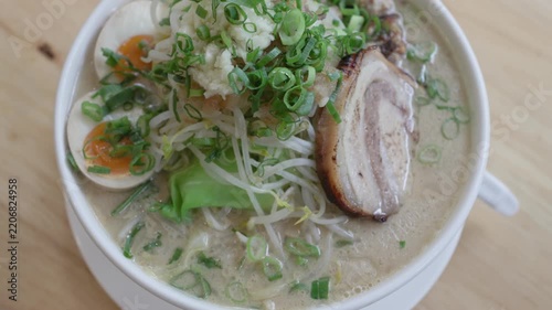 Jiro style ramen with pork egg and bean sprouts close up