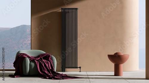 A modern anthracite radiator stands out against a beige wall in a stylish living room interior. Cozy details like a sage armchair and plum blanket evoke warmth and comfort.