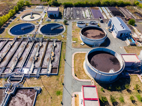 Water treatment plant located in a rural area showing various tanks and facilities involved in water processing