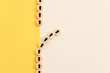 Arrows on wooden blocks, idea of thinking differently, setting goals and thinking about solution